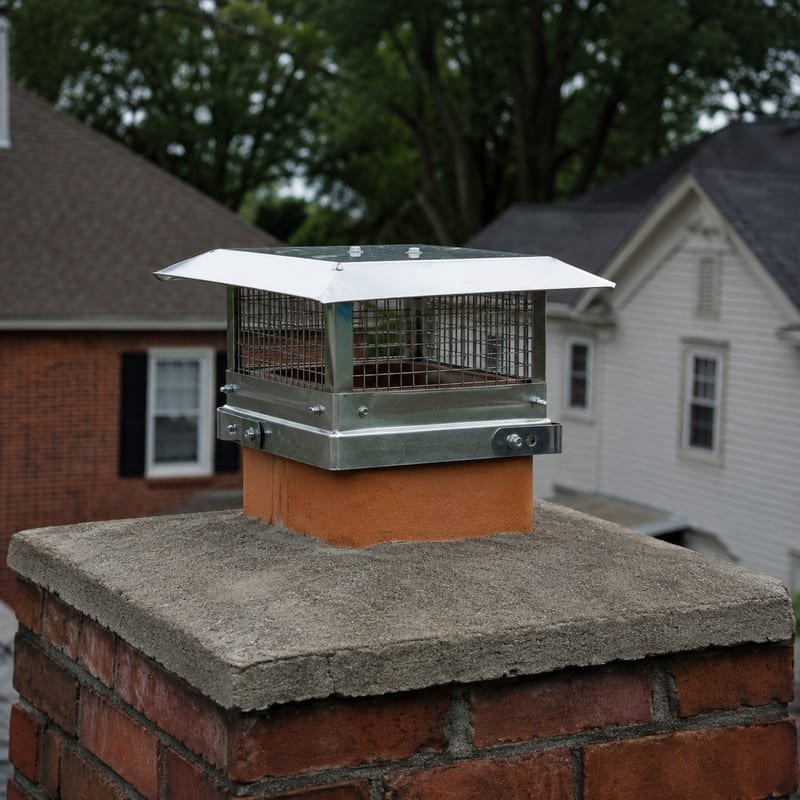 New stainless single-flue chimney cap installed on a brick chimney in Syracuse, NY
